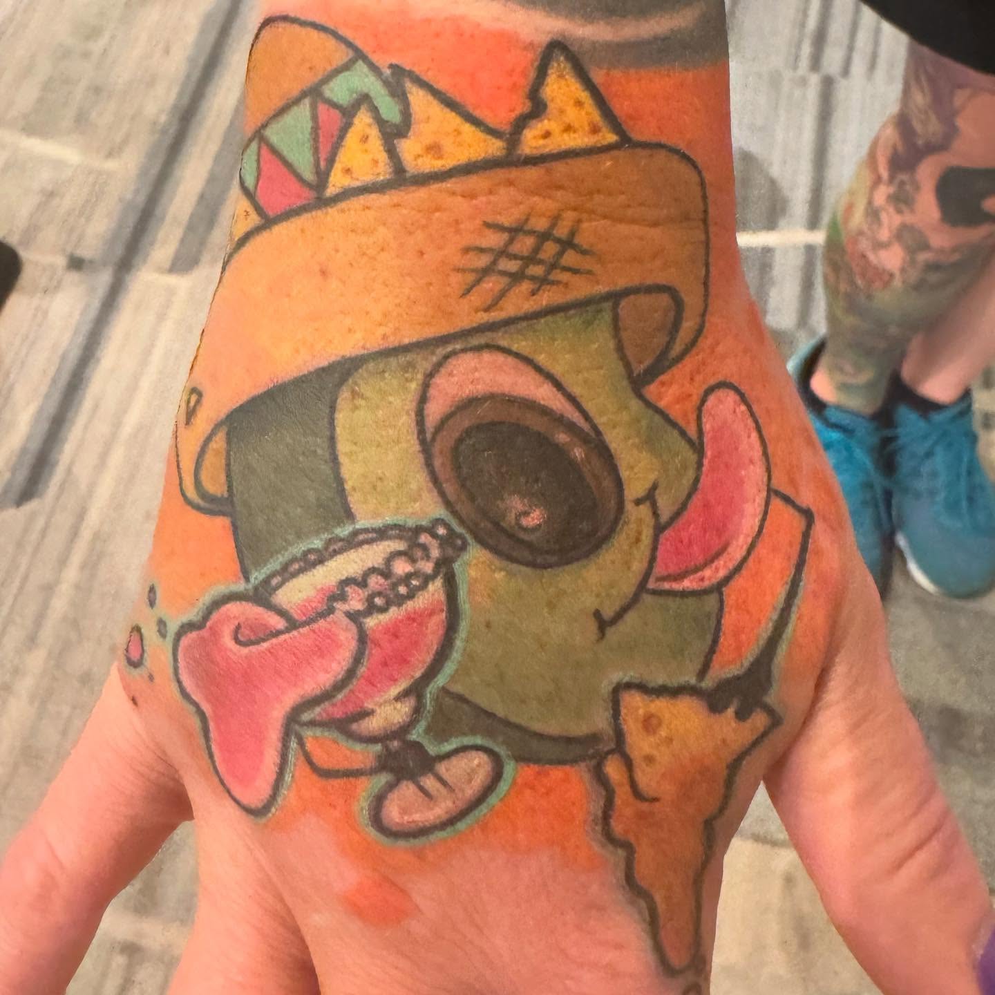 Skull with nachos American traditional tattoo on the forearm by Columbus Tattoo Artist