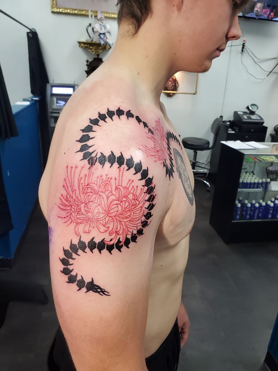 Chrysanthemum dotwork tattoo on the shoulder by Matthew Ray, Harrisburg, North Carolina
