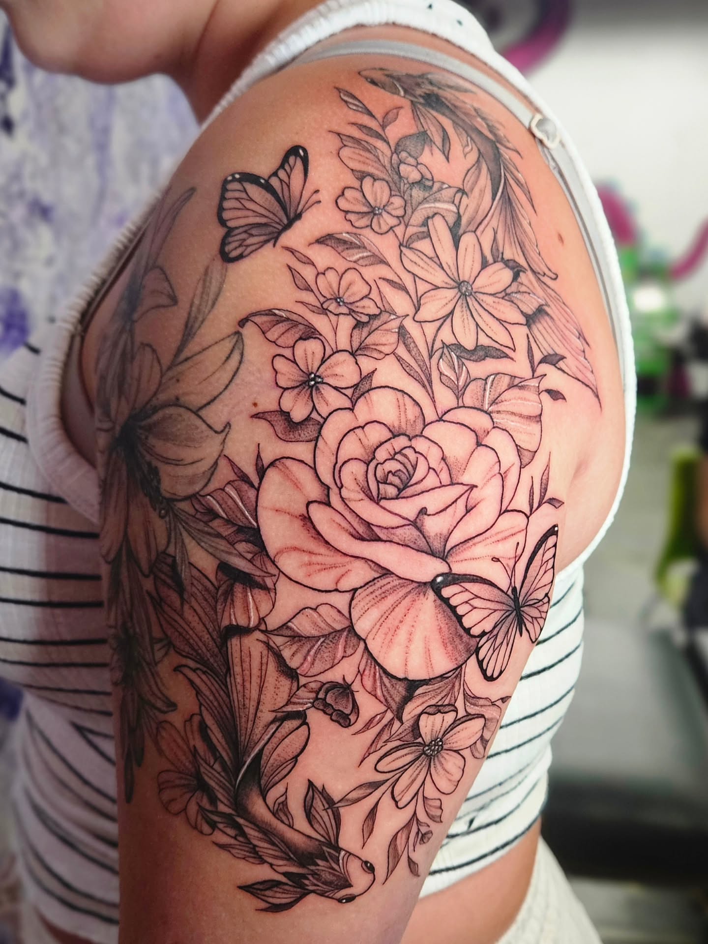 Floral bouquet realism tattoo on the shoulder by Kassy Fiori