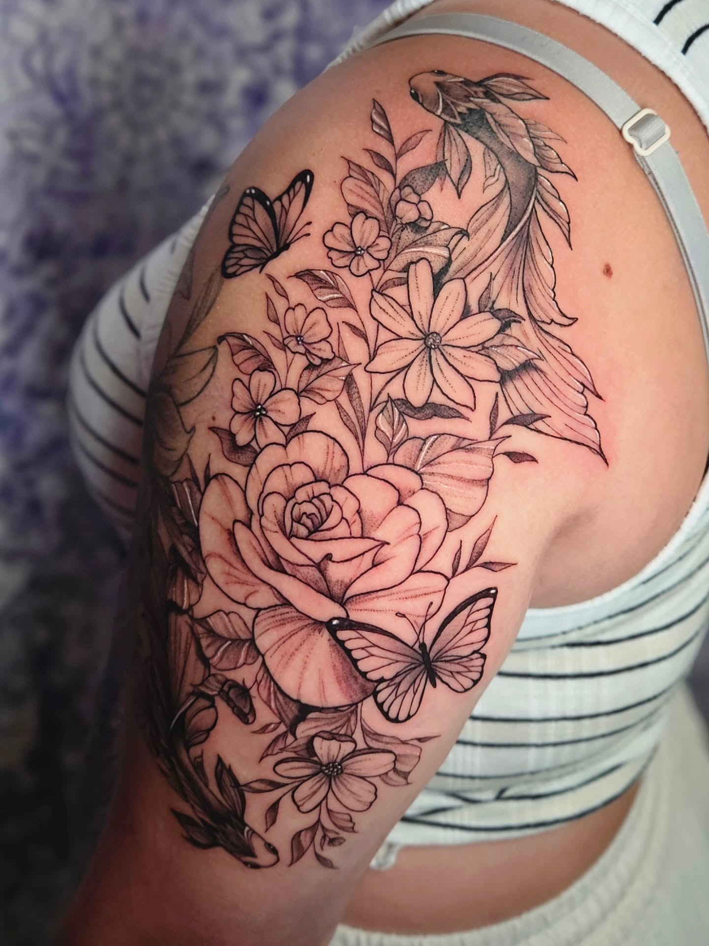 Flowers and butterflies realism tattoo on the shoulder by Kassy Fiori