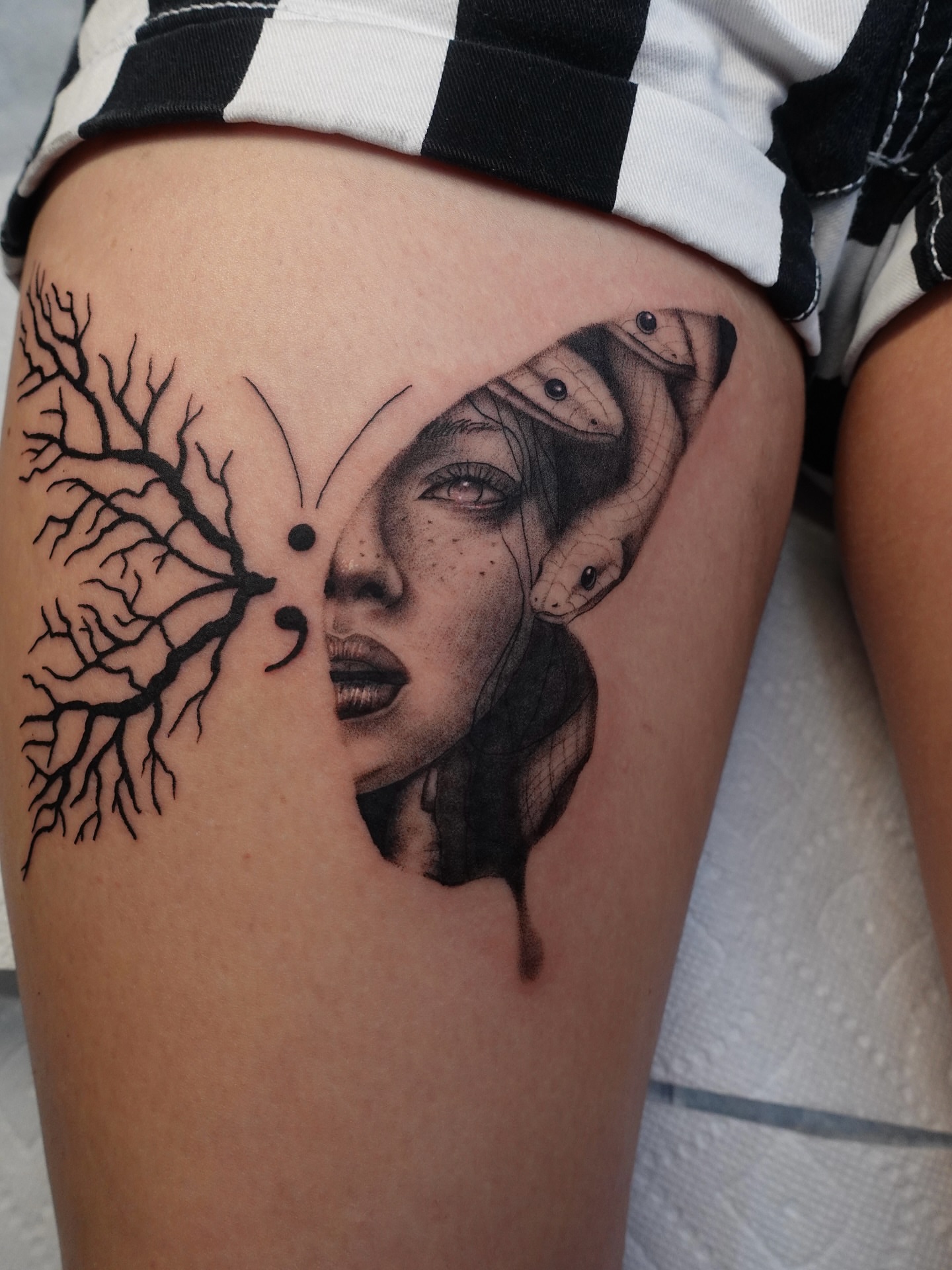 Woman's face with snakes realism tattoo on the thigh by Tat by Brendan