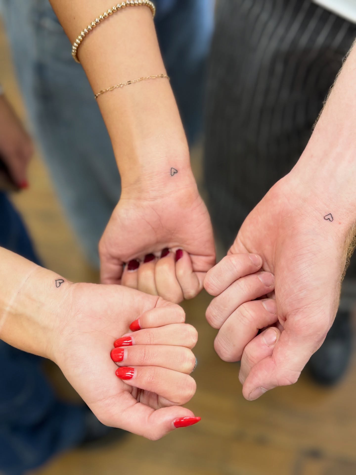 Heart fine line tattoo on the hand by Whimsy Ink