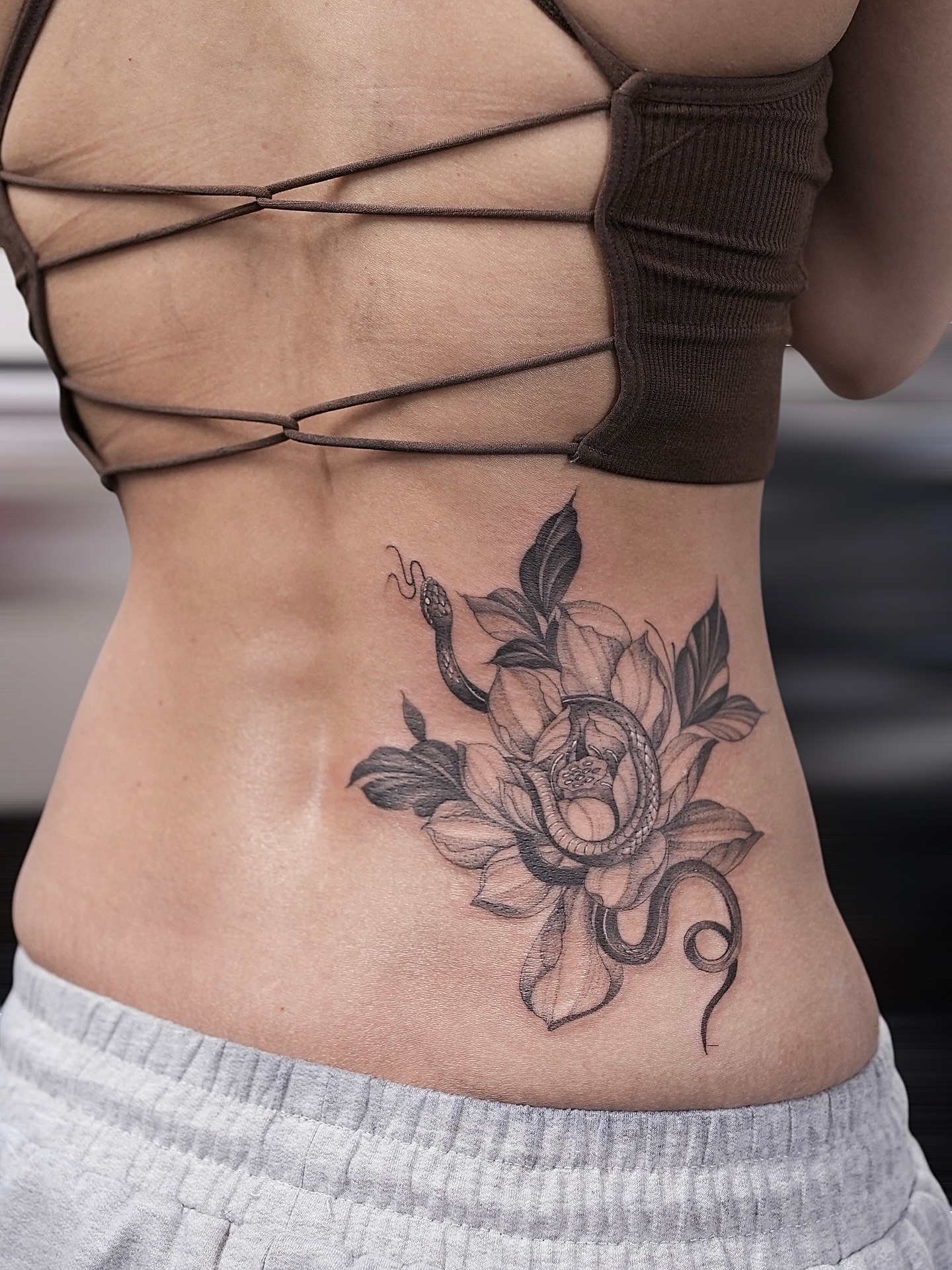 Snake and peony black and grey tattoo on the torso by X