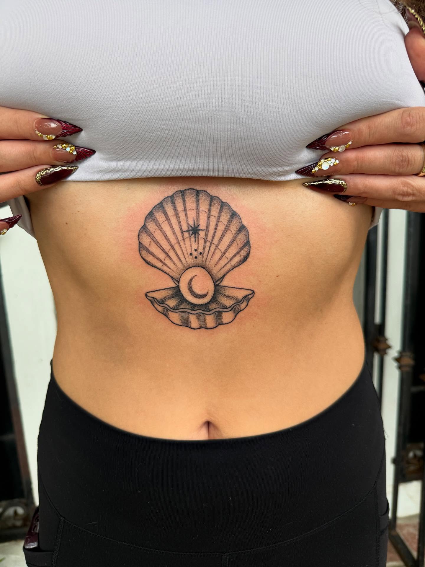 Scallop shell black and grey tattoo on the torso by π½πππππ π½πππππππ, New Orleans, Louisiana