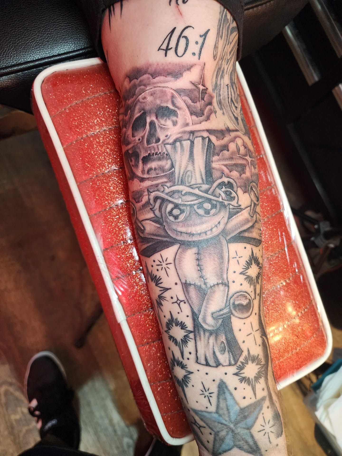 Skull and cheshire cat realism tattoo on the forearm by Joe Garcia
