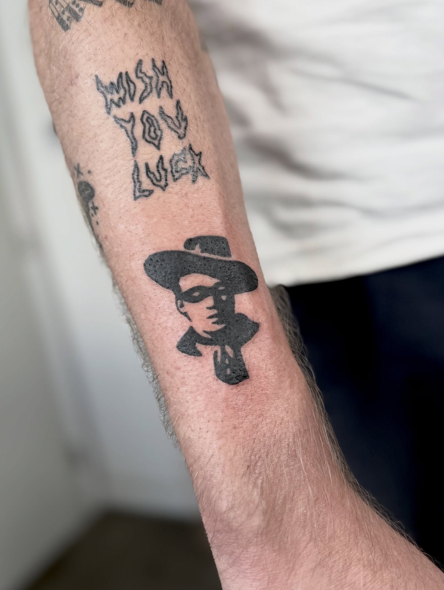 Cowboy silhouette black and grey tattoo on the forearm by Han shinko, Portland, Oregon
