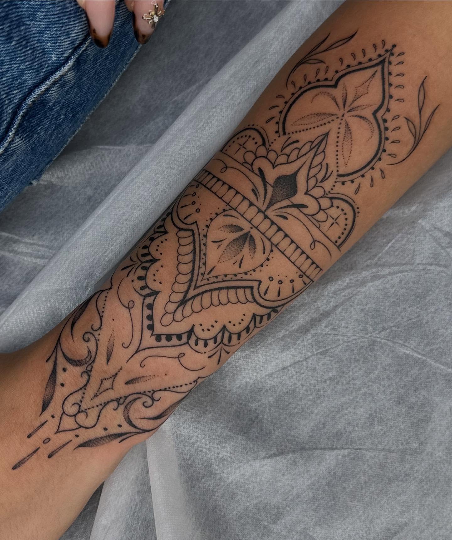Floral mandala ornamental tattoo on the forearm by Maggie Angulo