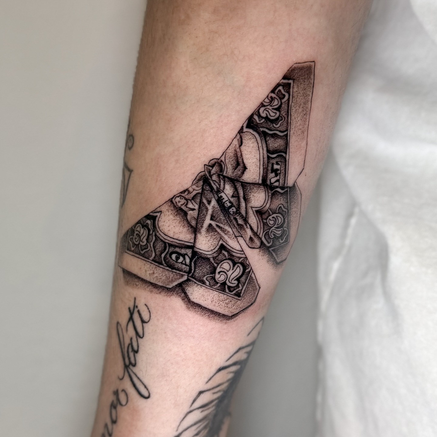 Playing card black and grey tattoo on the forearm by @sadfoo_tattoo, Austin, Texas