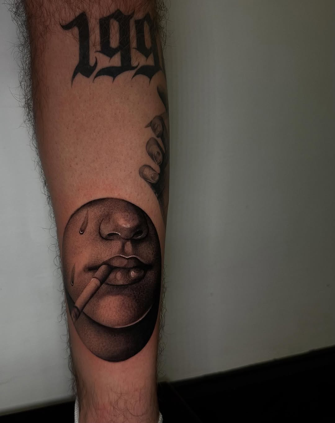 Face with cigarette surrealism tattoo on the forearm by @piinkywabbiit, Roselle Park, New Jersey
