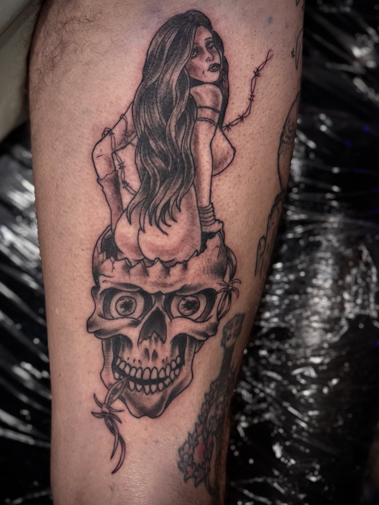 Woman on skull realism tattoo on the forearm by David C. McGhee