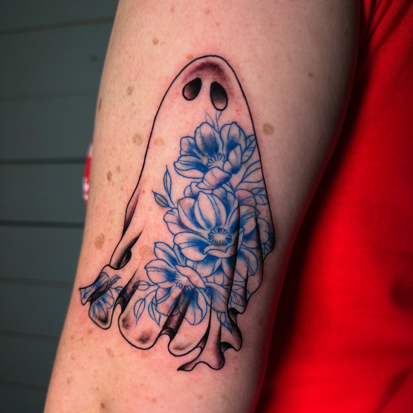 Ghost with flowers neo-traditional tattoo on the forearm by Tattoo & Body Artist, Gastonia, North Carolina