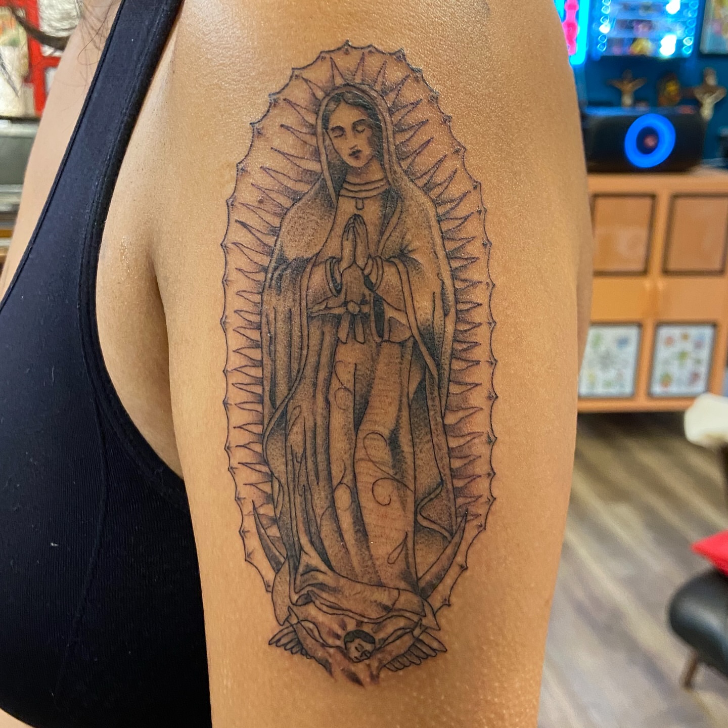 Virgin mary black and grey tattoo on the shoulder by Anthony Robles