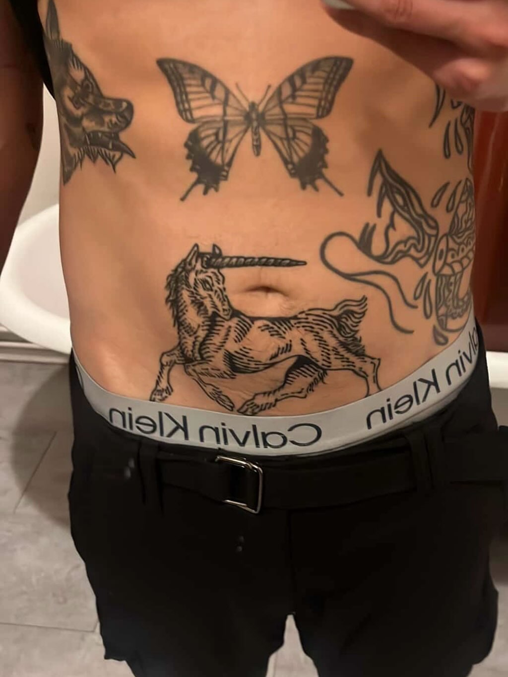 Unicorns and butterflies black and grey tattoo on the torso by Wonny