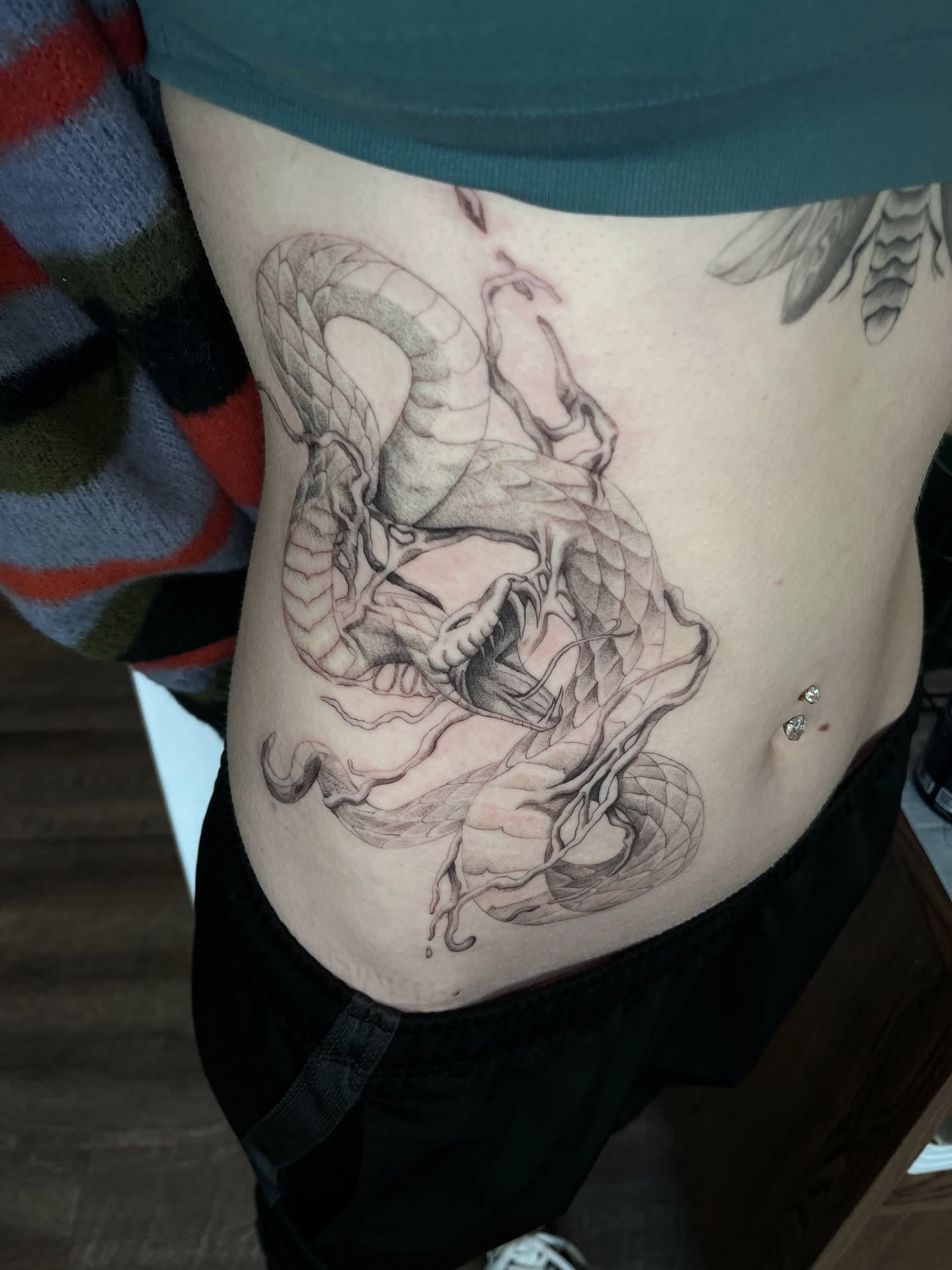 Dragon realism tattoo on the ribs by Samantha