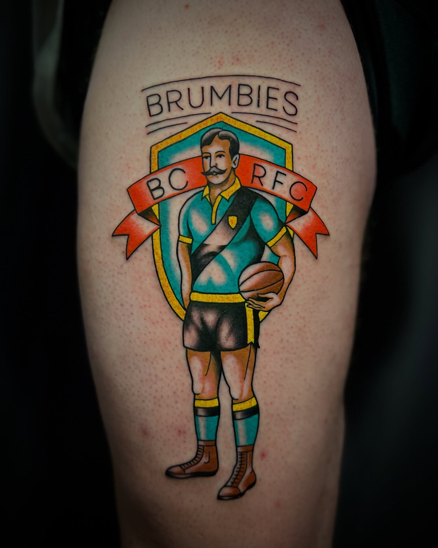 Rugby player American traditional tattoo on the thigh by Michael Munter, Philadelphia, Pennsylvania