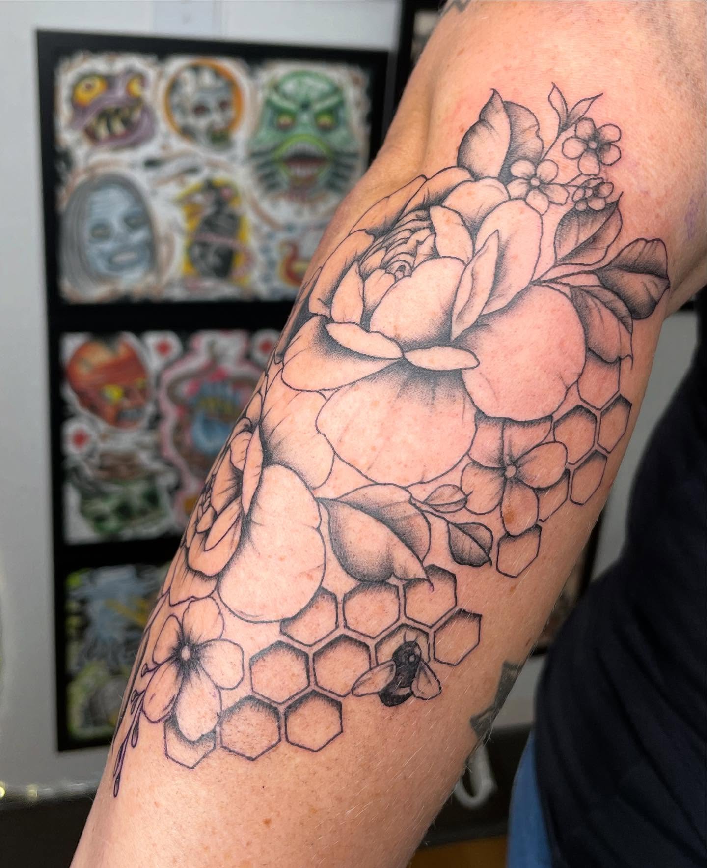 Flower and honeycomb realism tattoo on the forearm by Harlow ❤️‍🔥