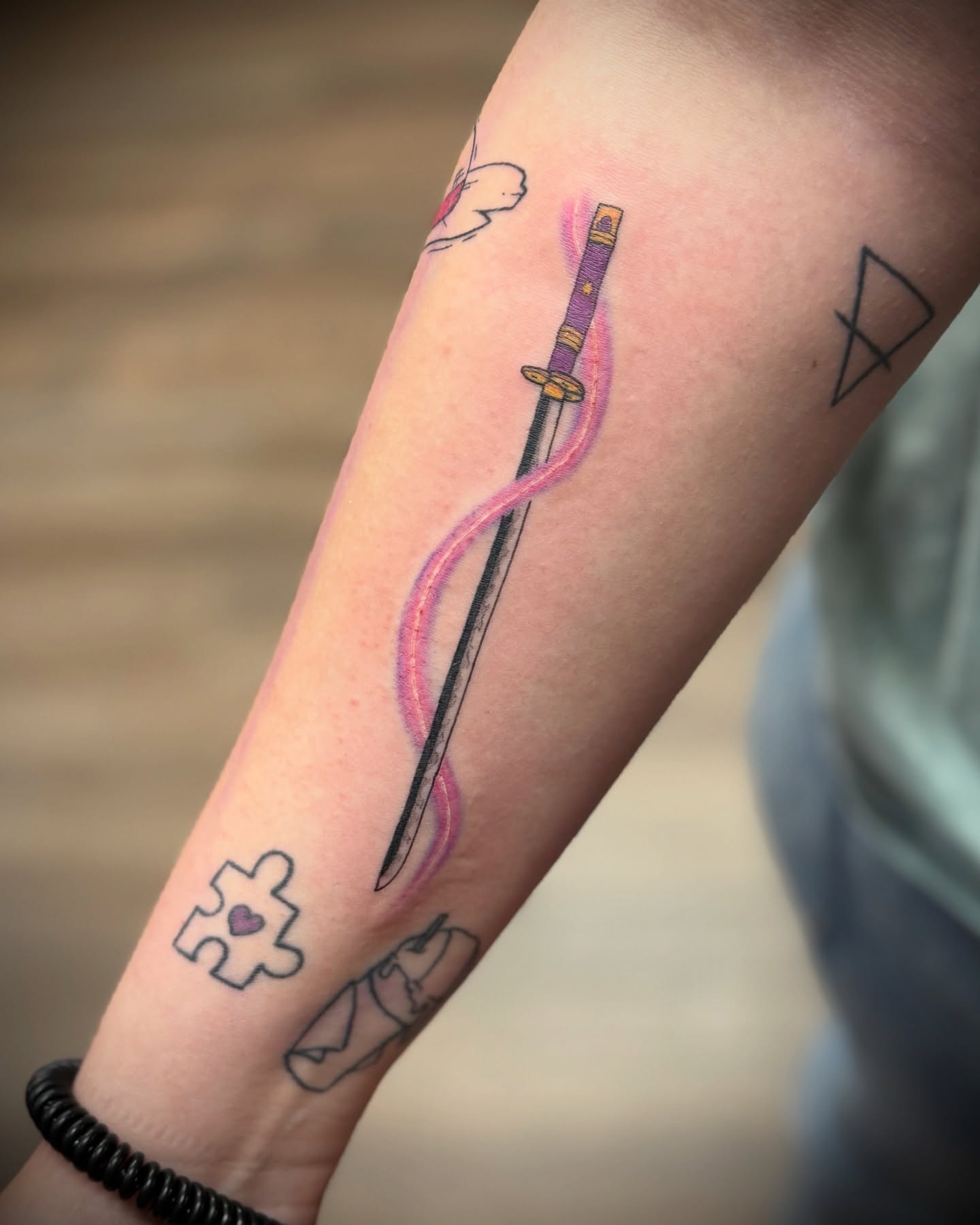 Katana with flame anime tattoo on the forearm by Justin Bianchini - New Orleans Tattoo Artist