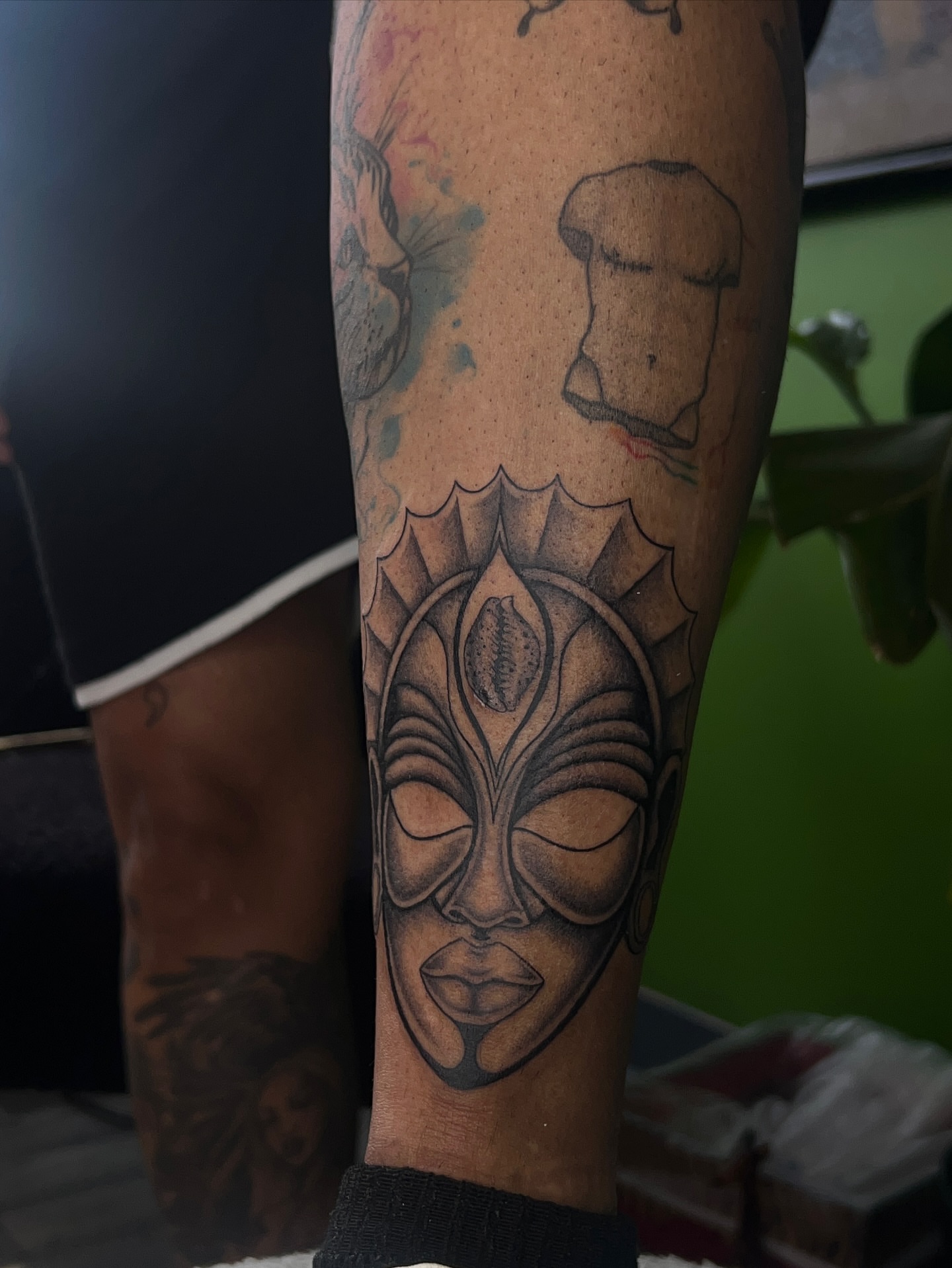 Mask black and grey tattoo on the forearm by ༻𝐓𝐡𝐞 𝐒𝐤𝐢𝐧 𝐆𝐚𝐫𝐝𝐞𝐧༺