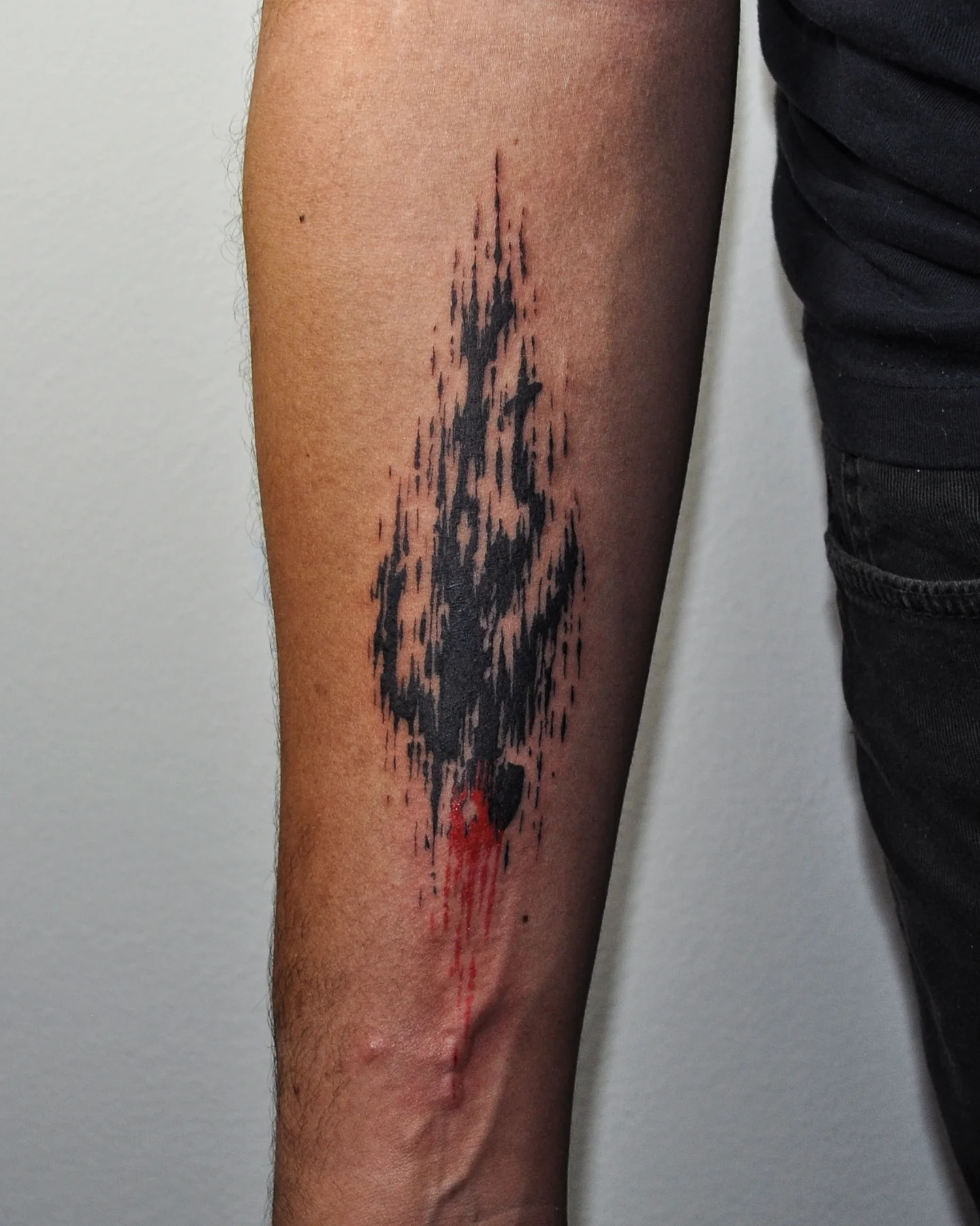 Abstract splatter dotwork tattoo on the forearm by Bek Artz