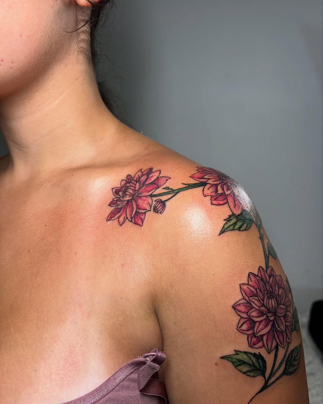 Dahlia flowers neo-traditional tattoo on the shoulder by Victoria