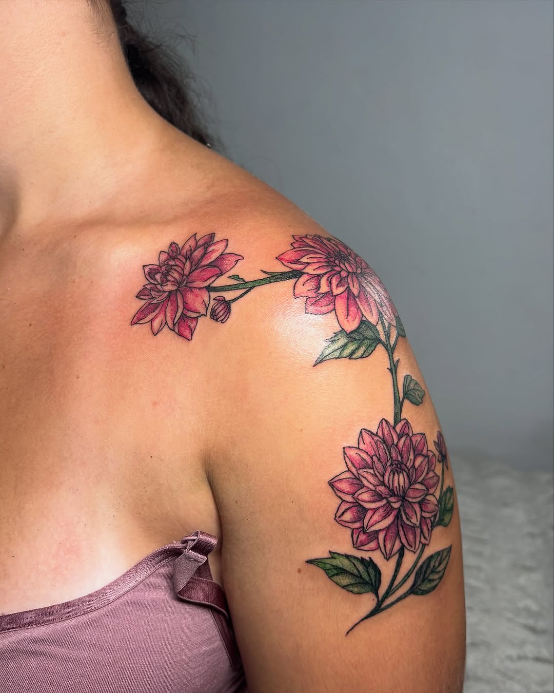Dahlia flowers neo-traditional tattoo on the shoulder by Victoria