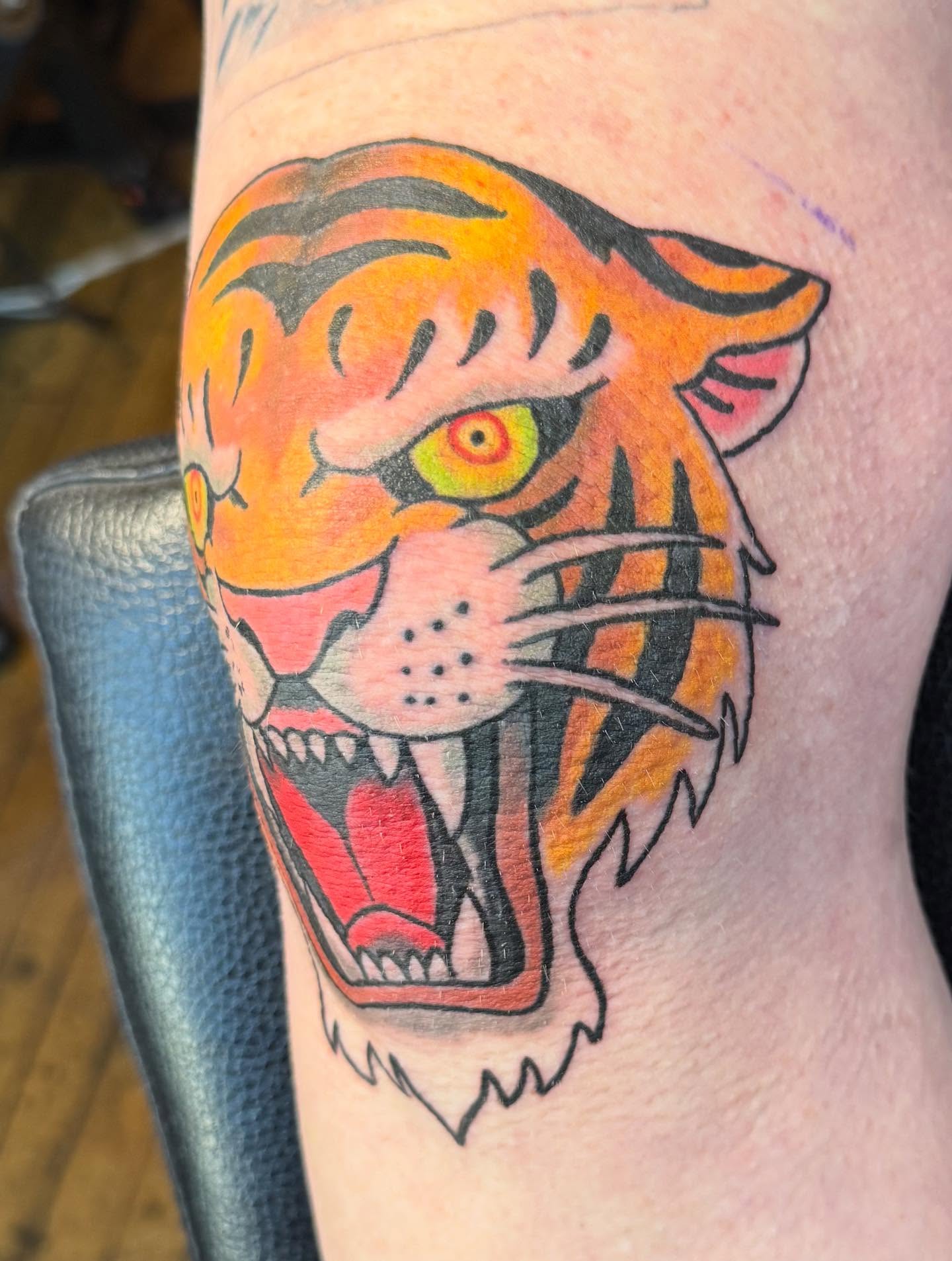 Tiger American traditional tattoo on the forearm by Patrick Cornolo