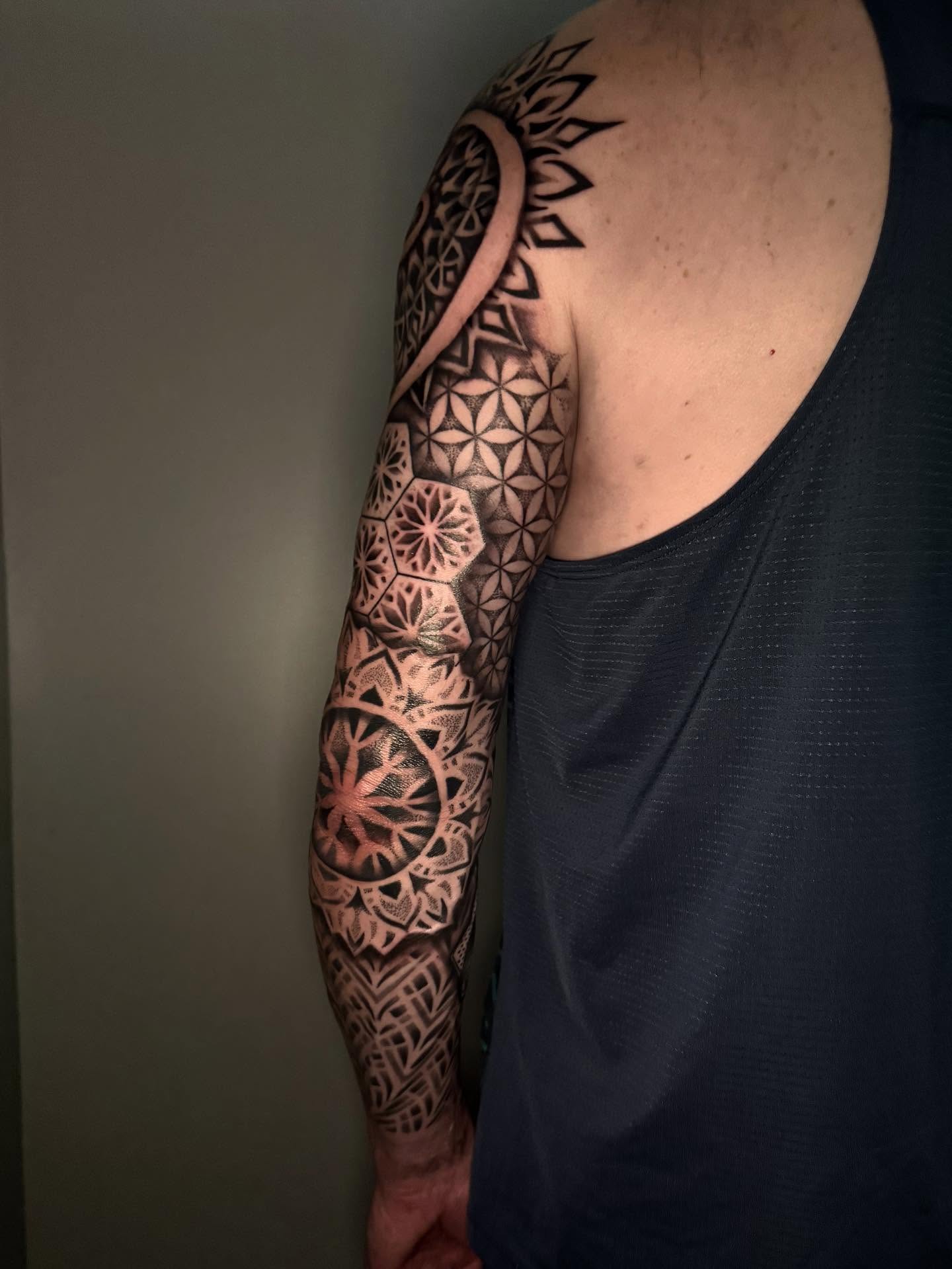 Geometric patterns geometric tattoo on the upper arm by Diana Guillette