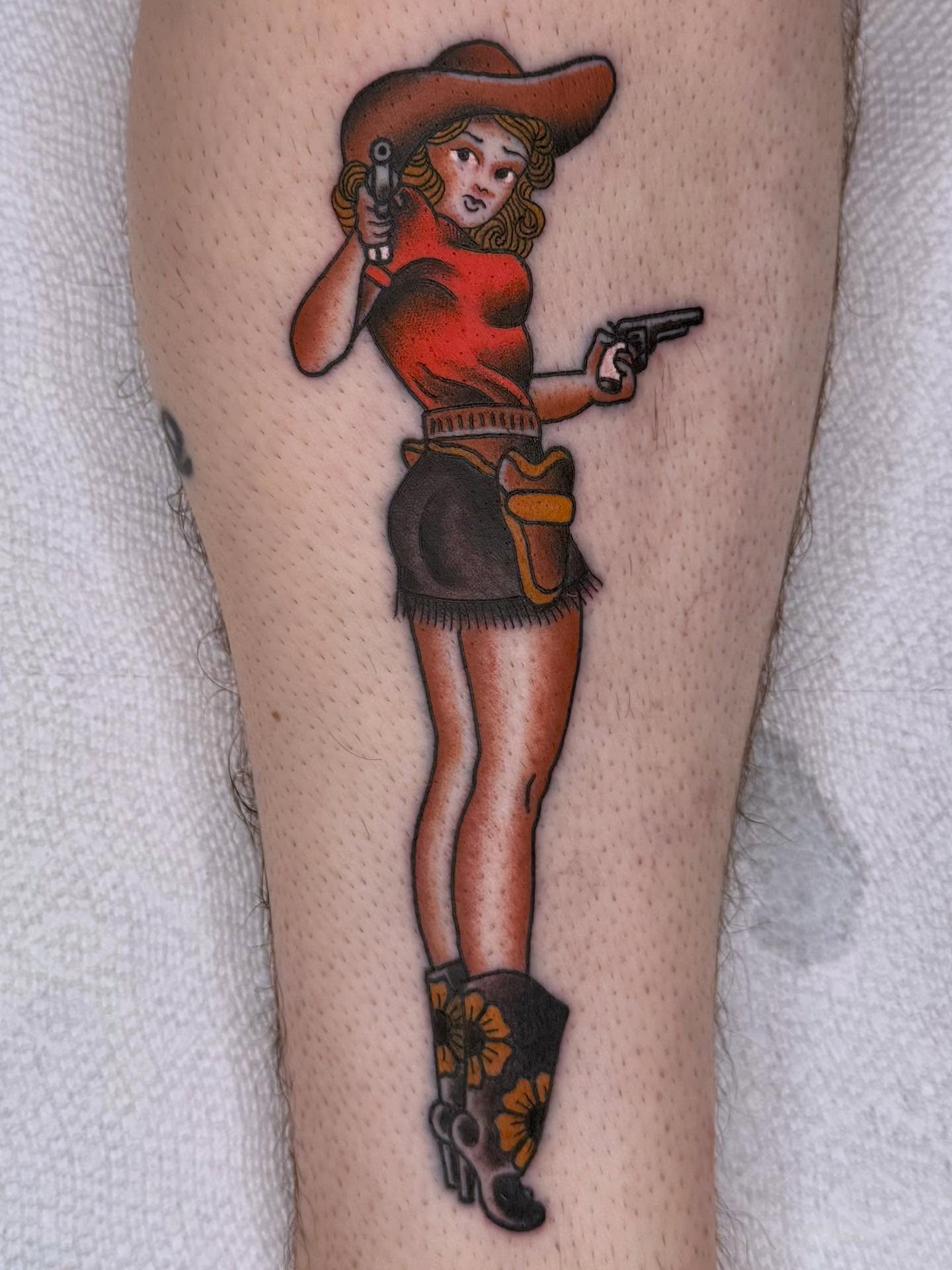Cowgirl American traditional tattoo on the leg by Curtis Stairs, Seattle, Washington