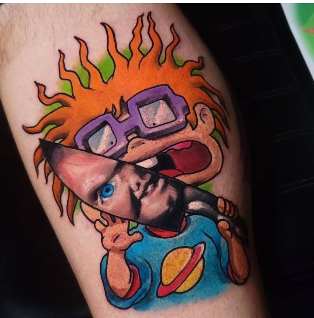 Calvin and Hobbes American traditional tattoo on the thigh by Cody Gower Tattoo Artist