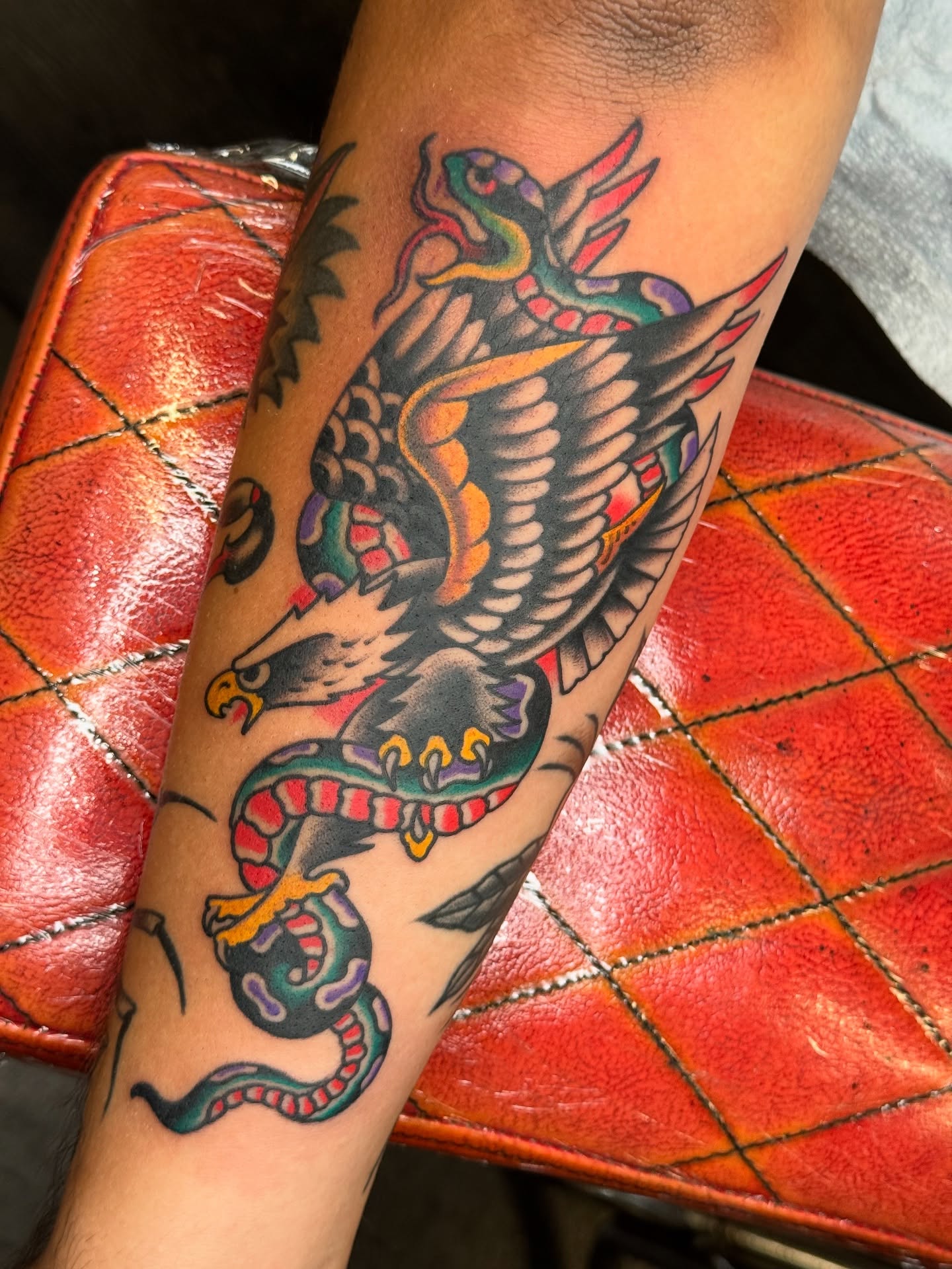 Eagle and snake American traditional tattoo on the forearm by Ben Karnofsky