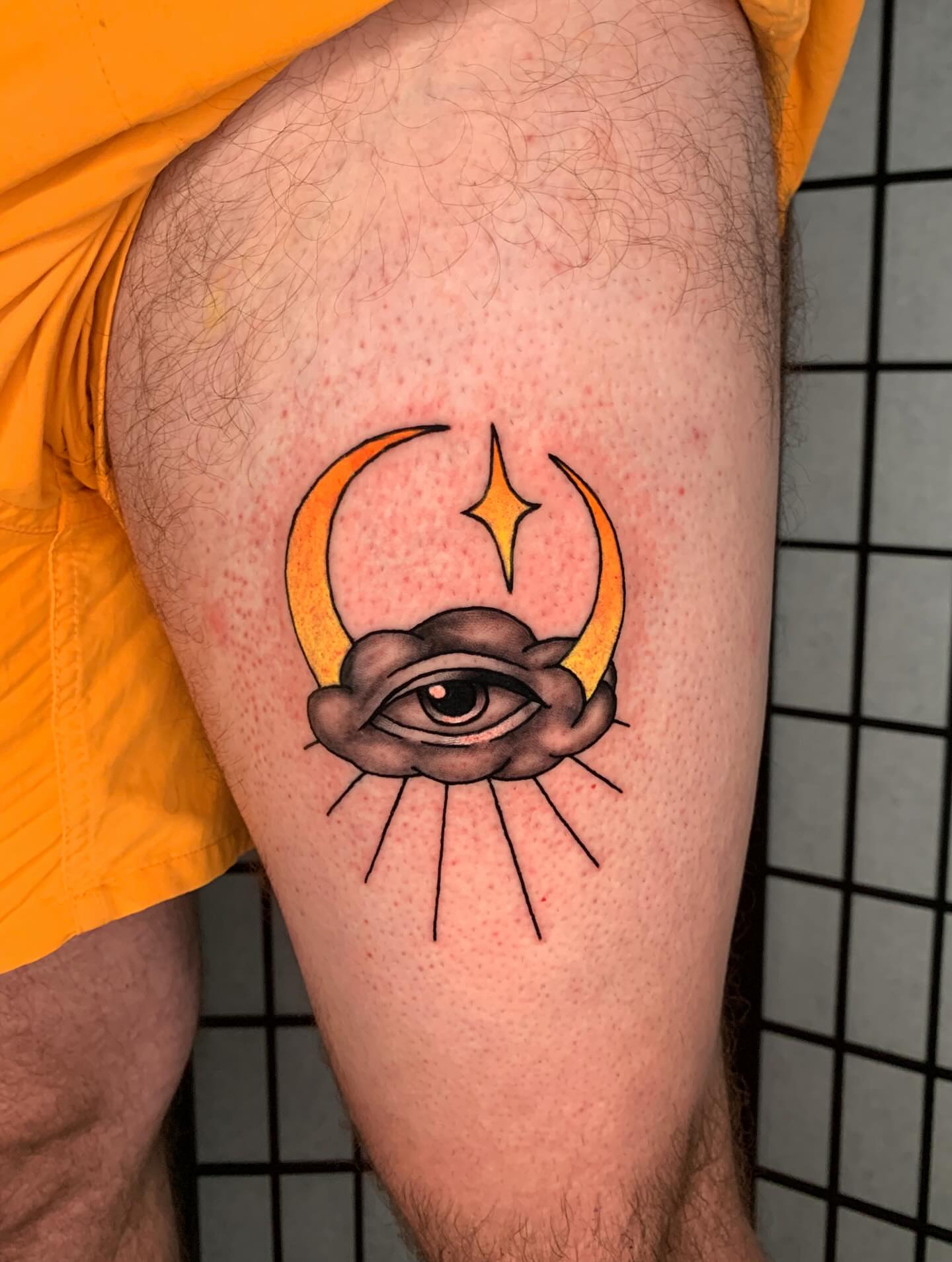 Eye with crescent moon and star neo-traditional tattoo on the thigh by Devon