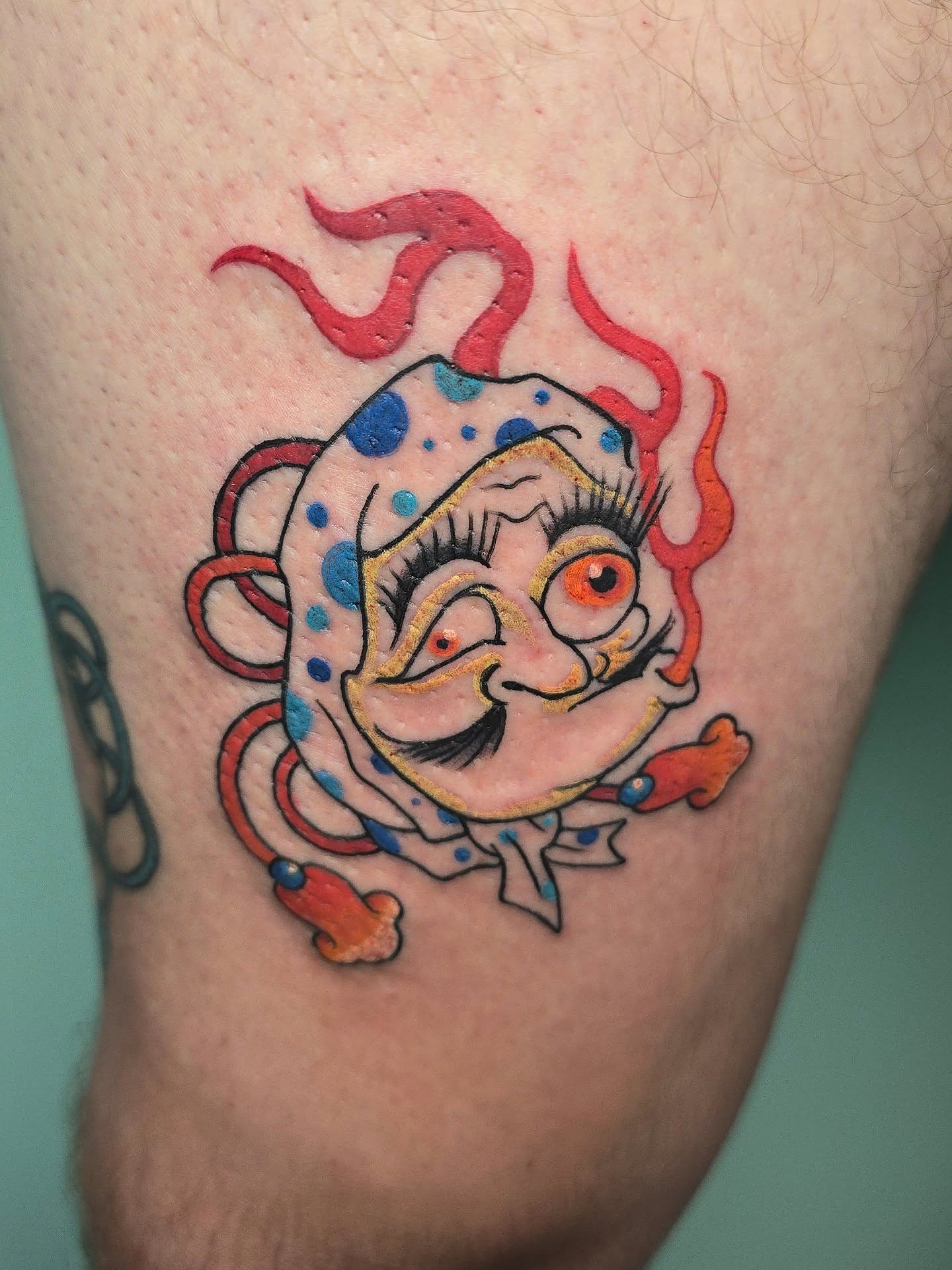 Clown American traditional tattoo on the thigh by Joseph Jeffers