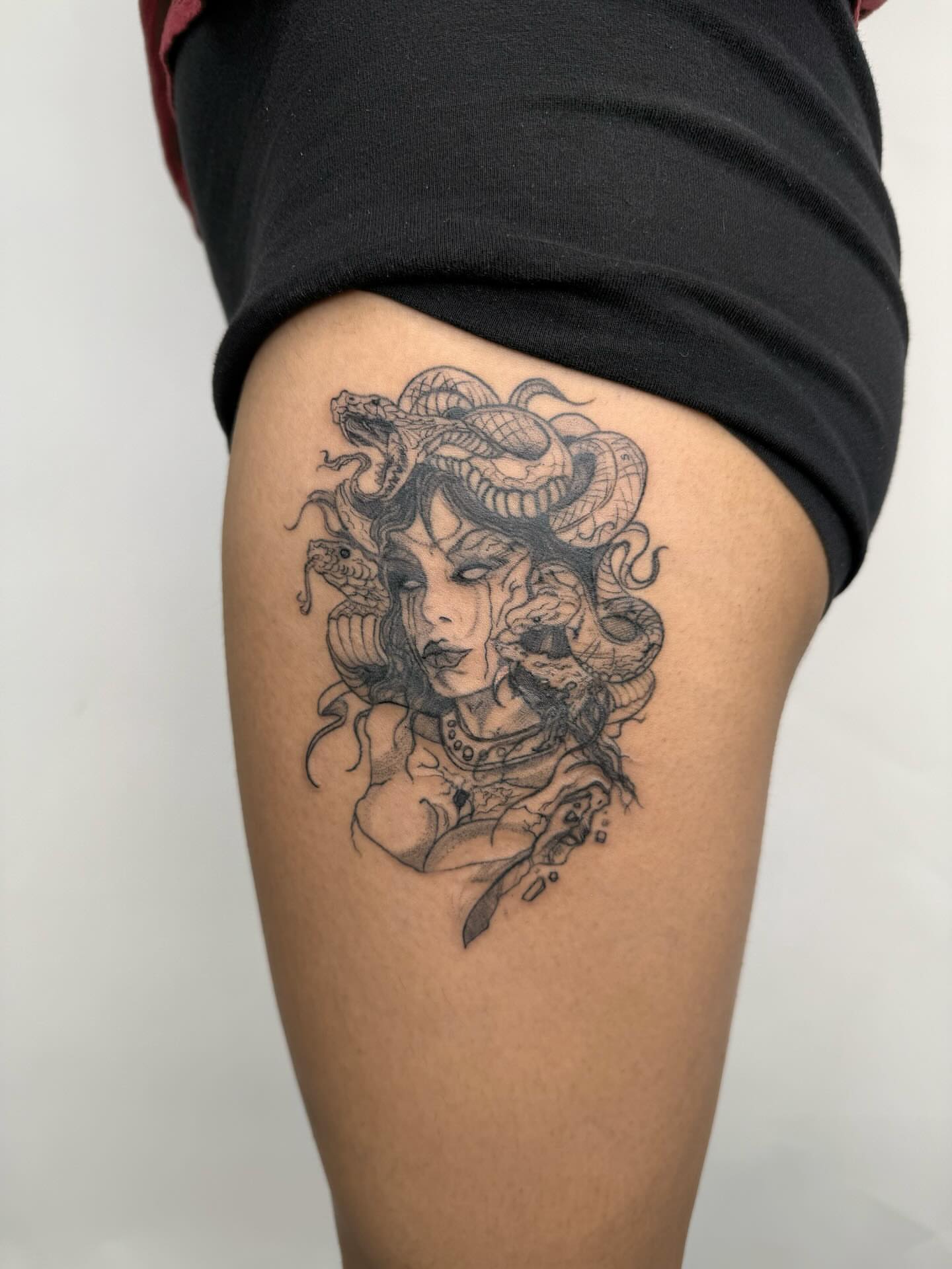 Medusa black and grey tattoo on the thigh by Joey tattoo