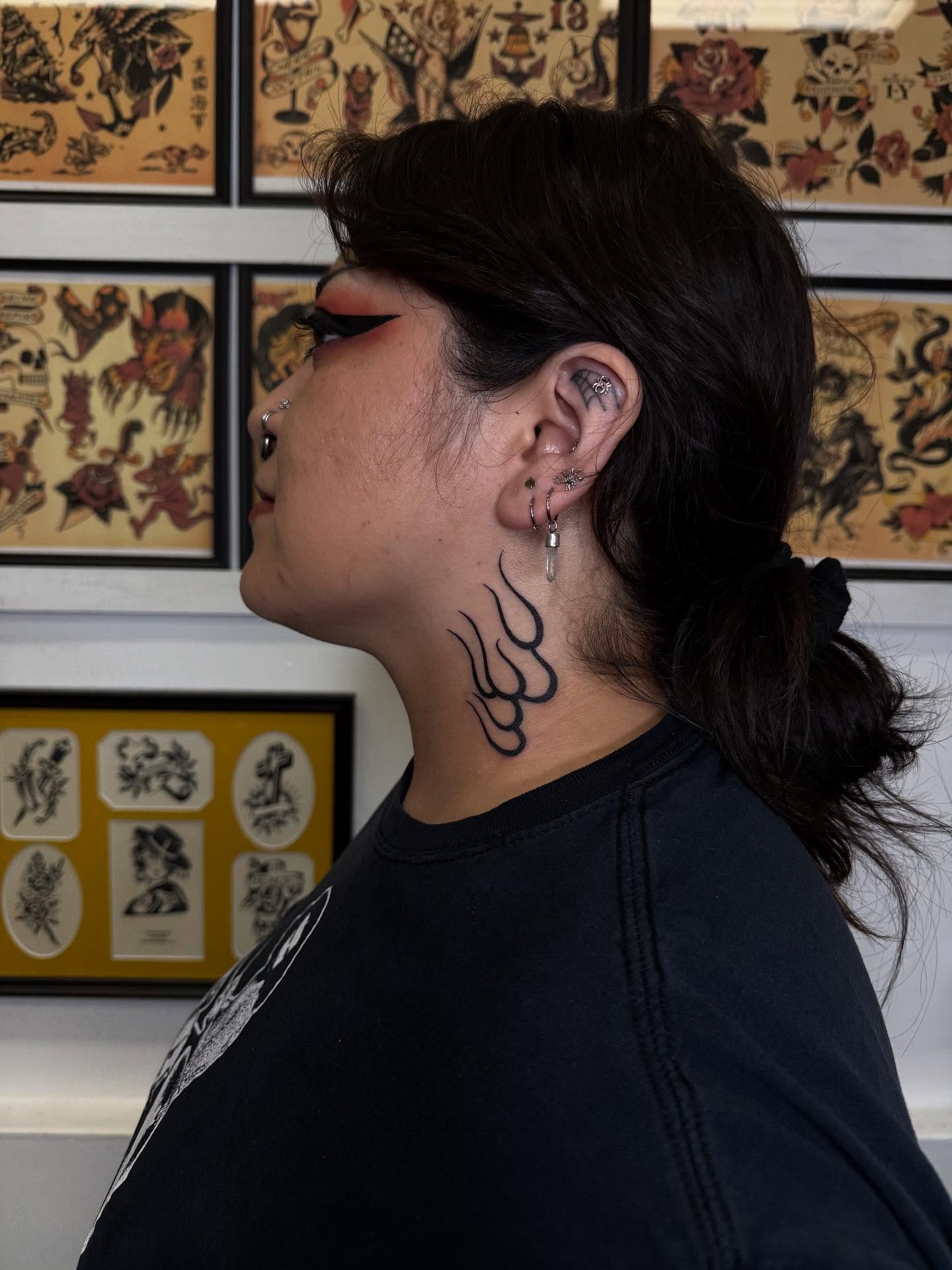 Tribal tribal tattoo on the neck by Erin Shea