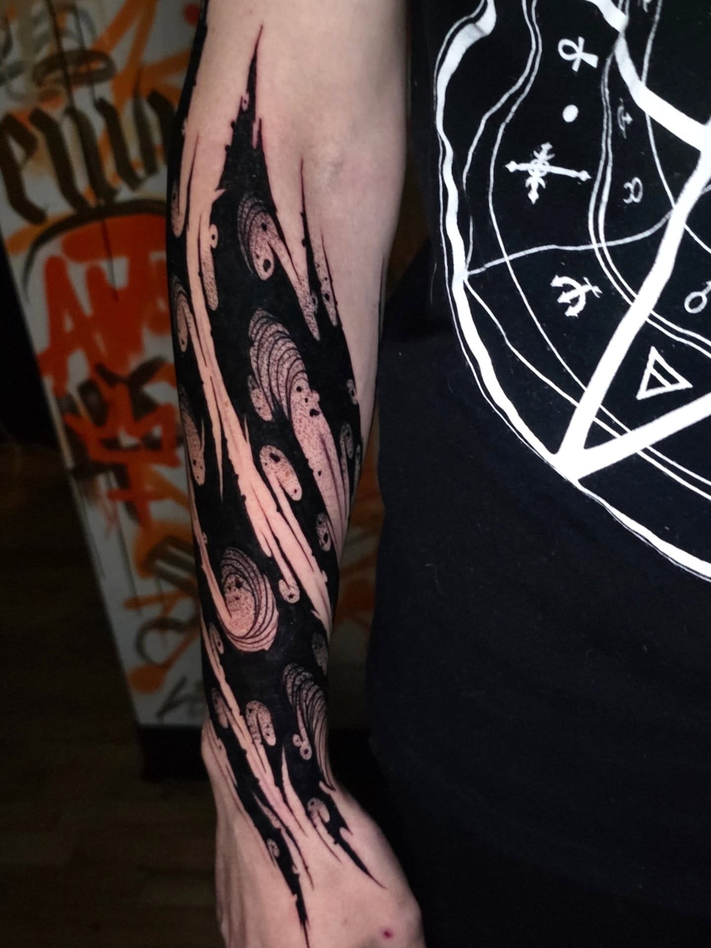 Octopus tentacles blackwork tattoo on the forearm by Kelsey Lorrae, Ankeny, Iowa