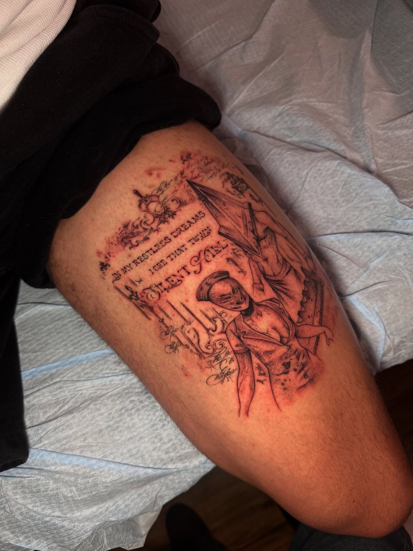 Book cover black and grey tattoo on the thigh by aamora ꩜