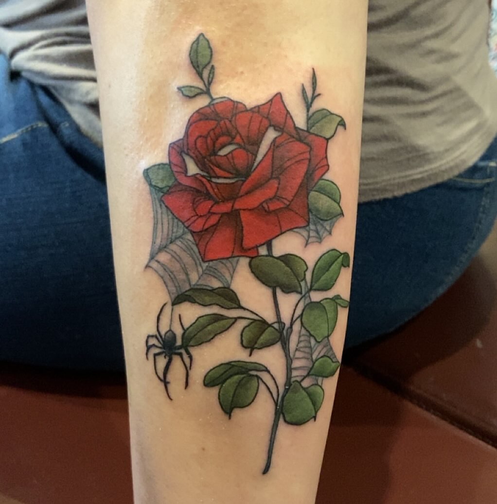 Red rose realism tattoo on the forearm by Erin McGloin