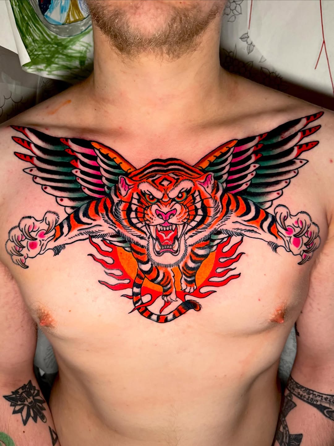 Winged tiger with flames realism tattoo on the chest by Seth Walker