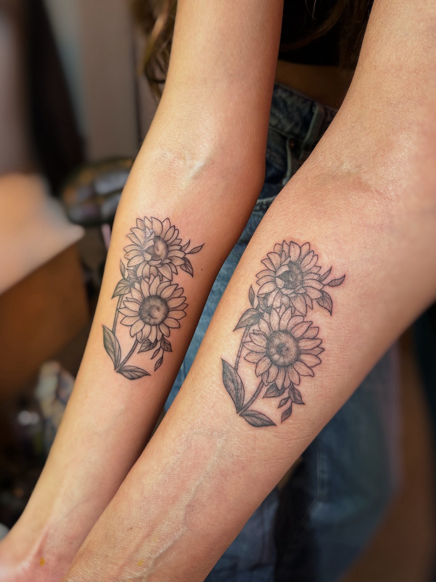 Sunflower black and grey tattoo on the forearm by Lily Bejarno