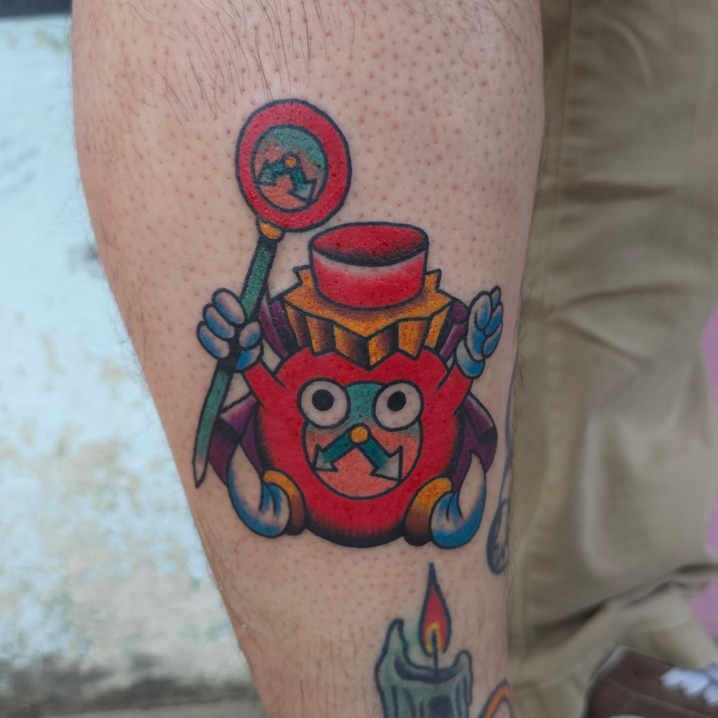 Red monster American traditional tattoo on the forearm by Jared Green