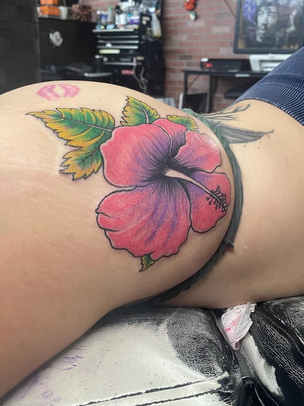 Hibiscus flower realism tattoo on the thigh by Vanessa - Dallas Artist