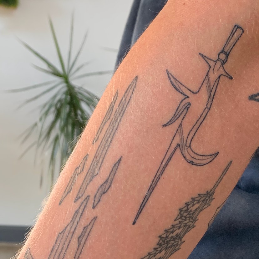 Sword black and grey tattoo on the forearm by Tabby Wirebach, Kutztown, Pennsylvania