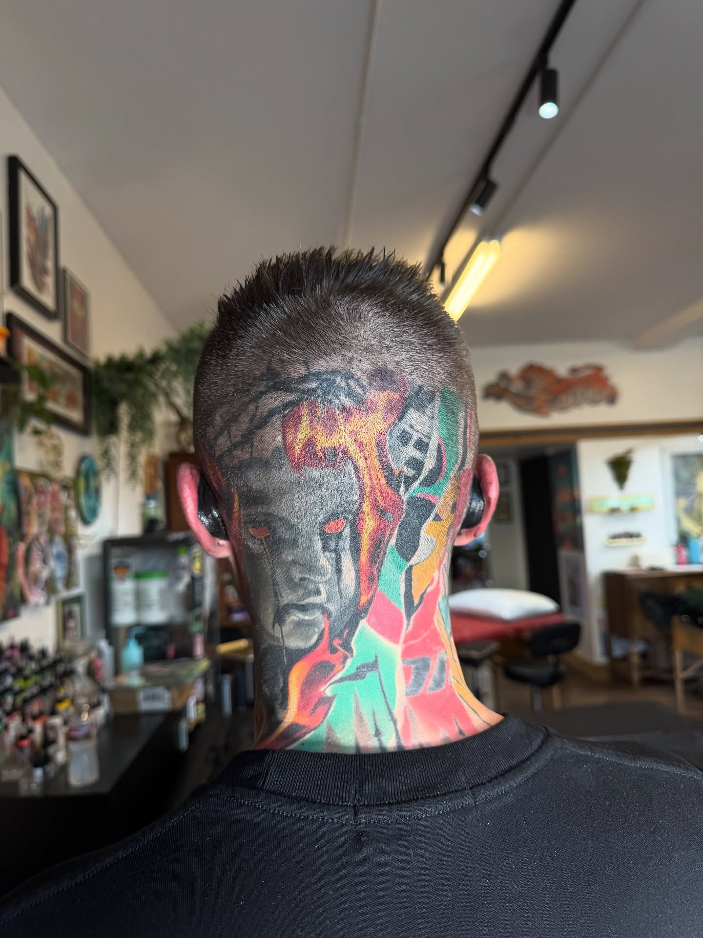 Abstract face dotwork tattoo on the neck by Denver Blackout Tattoo Specialist - Anthony