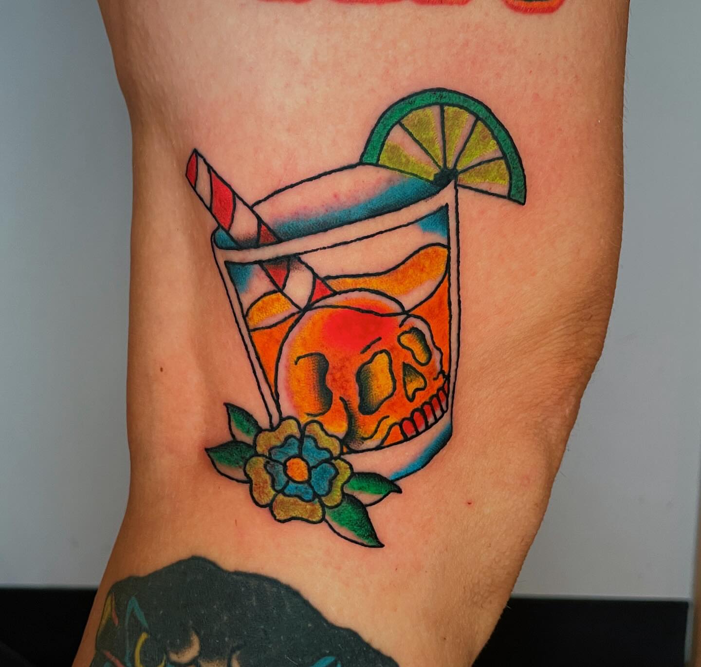 Skull cocktail American traditional tattoo on the forearm by Glume Tattoo