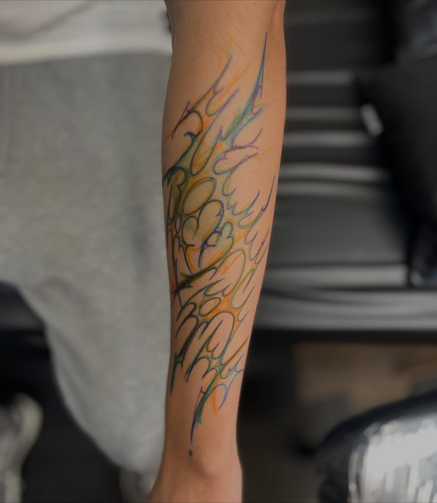 Flame new school tattoo on the forearm by Katlyne Jones