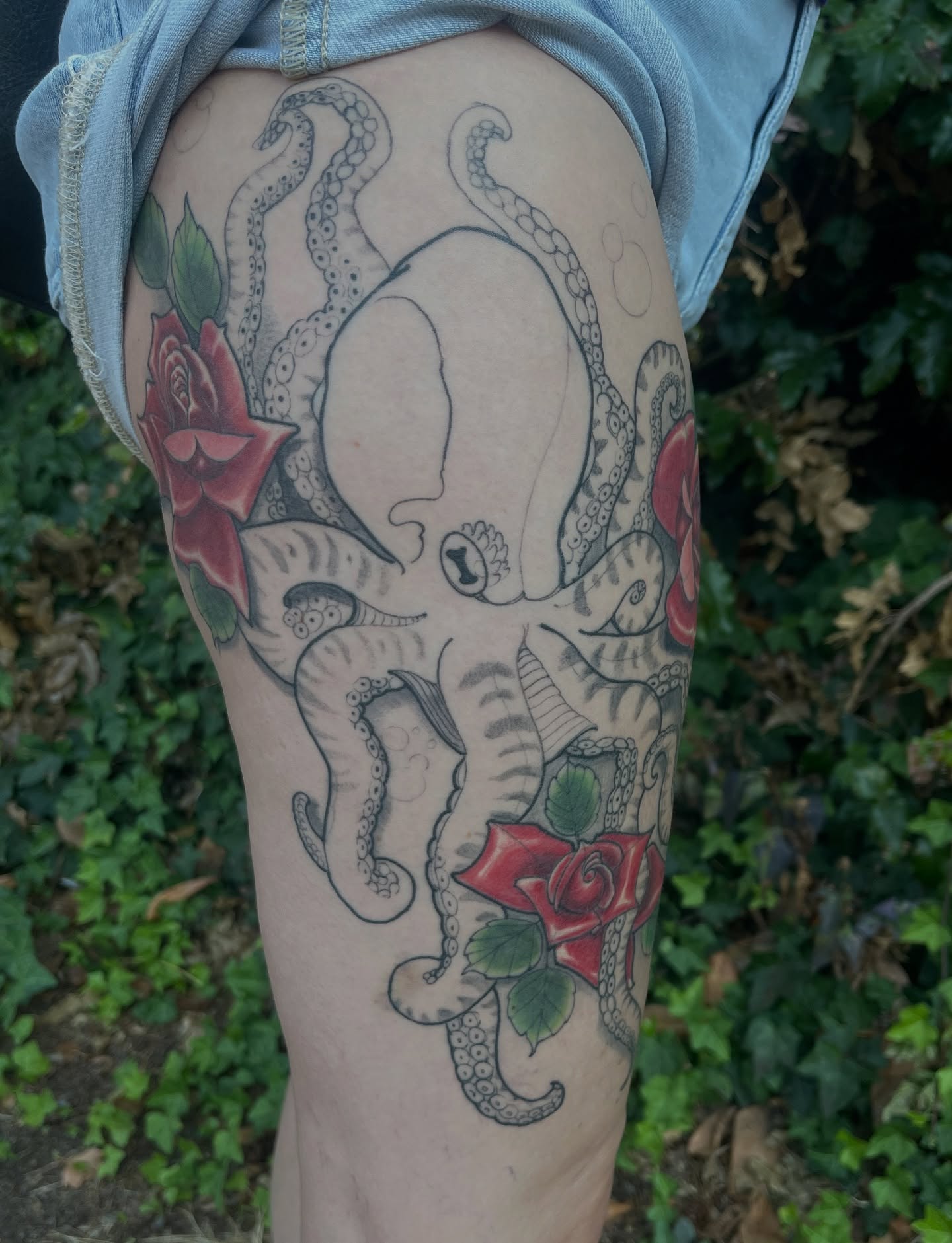 Octopus and roses American traditional tattoo on the thigh by ๐ต๐๐๐ ๐ฐ๐๐๐