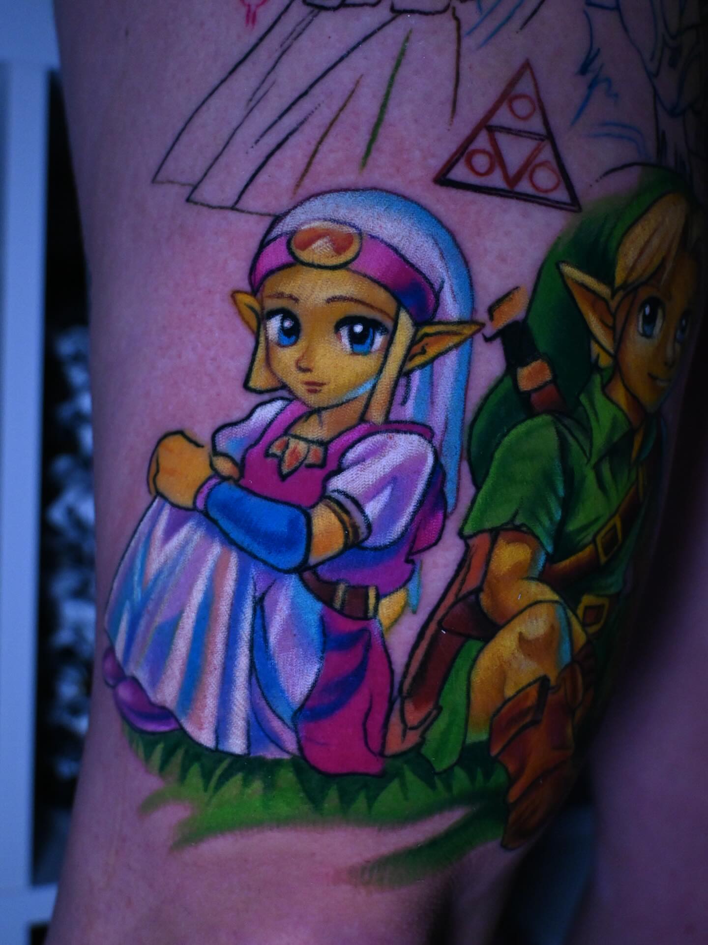 Zelda and link anime tattoo on the forearm by William Pollock