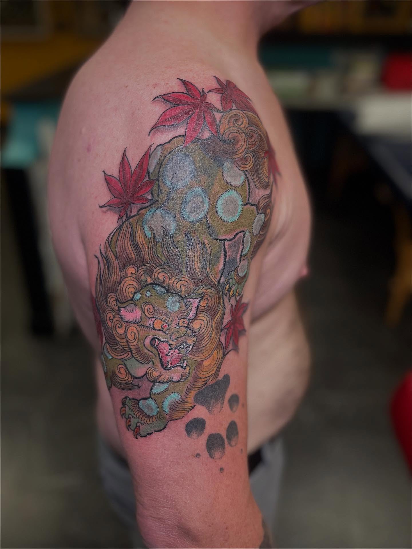 Lion and maple leaves japanese irezumi tattoo on the upper arm by ๐ต๐๐๐ ๐ฐ๐๐๐