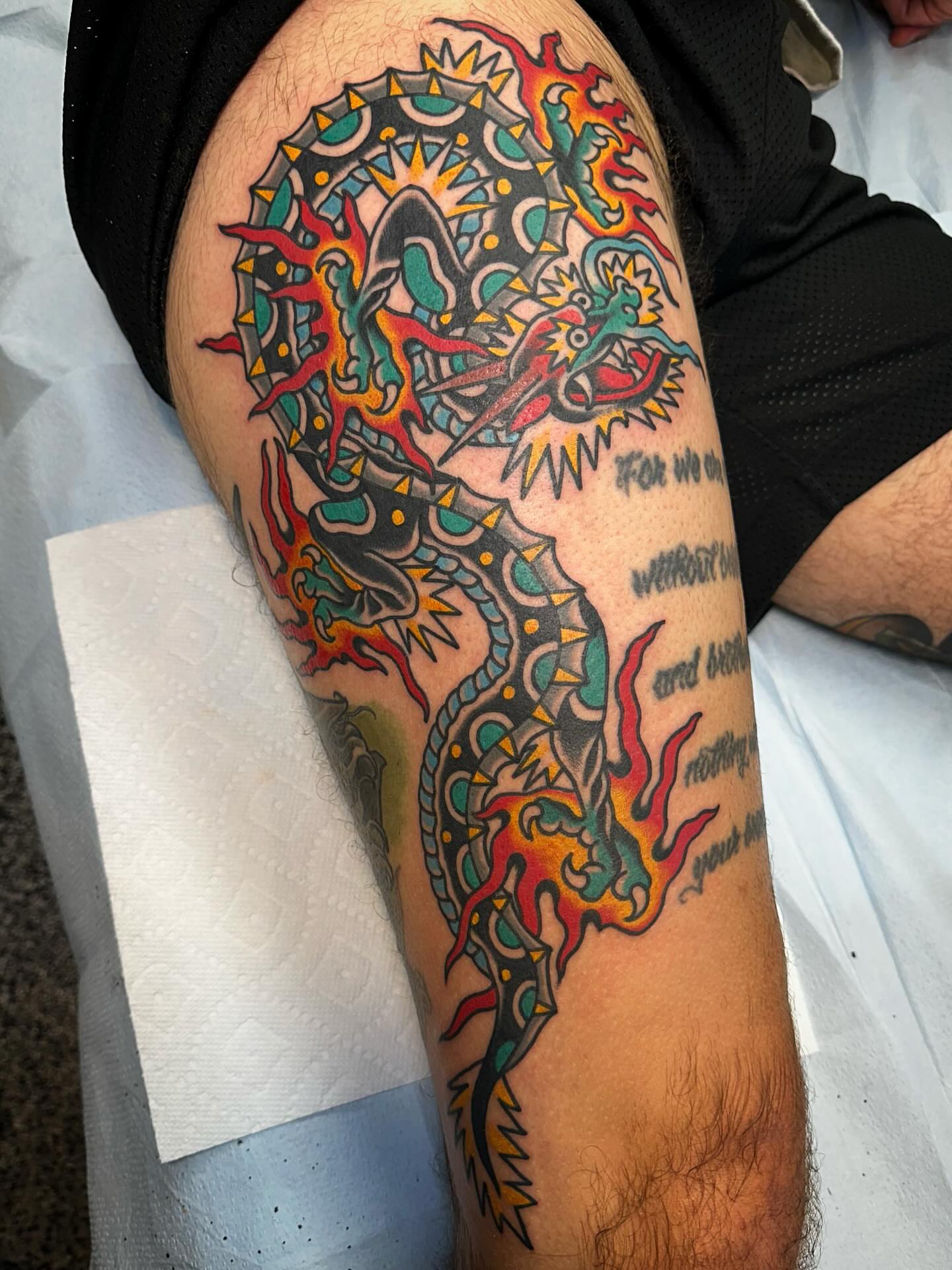 Dragon American traditional tattoo on the thigh by Nathan Rohrbacher, Nashville, Tennessee