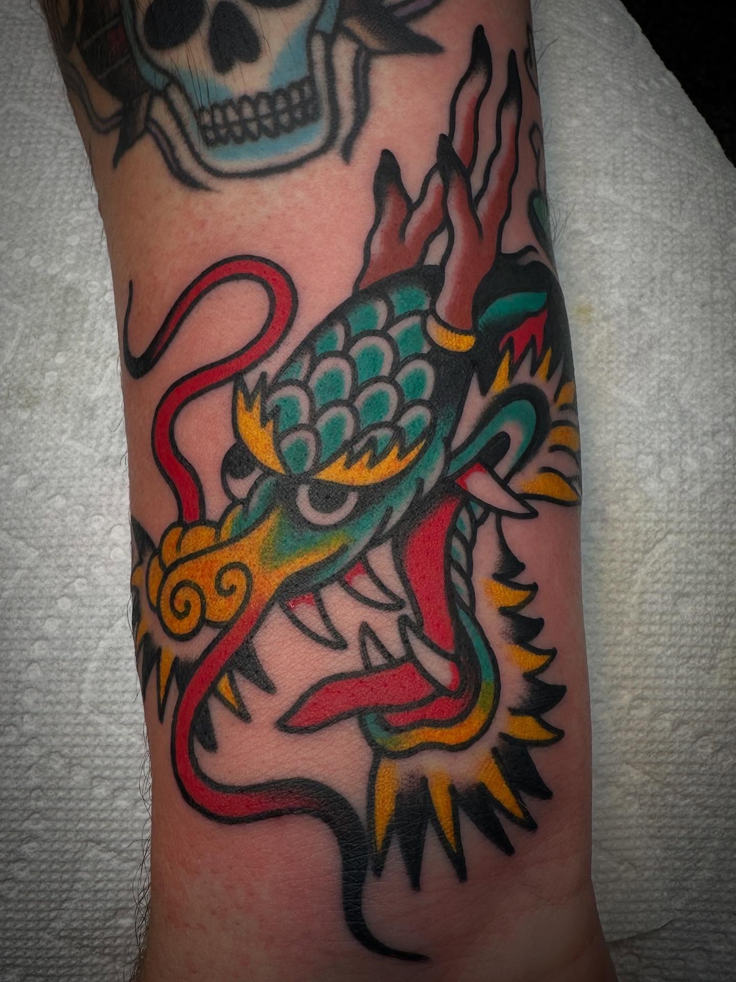Dragon American traditional tattoo on the forearm by Nathan Rohrbacher, Nashville, Tennessee
